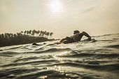 Silhouette of man surfboarding in the Indian ocean, Sri Lanka
