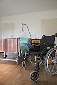 Room with nursing bed and wheelchair