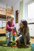 Mother playing with her son with toy building blocks, Munich, Germany