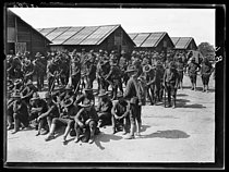 Roger-Viollet | 401179 | World War I. Arrival of the first US contingents in France. US soldiers settling in their camp near Saint-Nazaire (France), late June 1917. Photograph published in the newspaper  Excelsior , late June 1917. | © Excelsior - L'Equipe / Roger-Viollet