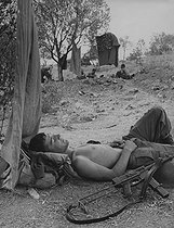 Roger-Viollet | 454920 | Algerian War of Independence. Cherchell Infantry Military School. Military cadets having some rest after a training exercise in the mountains. The aspiring officers carry more than 20 kg of equipment during a 40 to 50 km walk in the Jabal. Algeria, September 1960. | © Jean-Pierre Laffont / Roger-Viollet