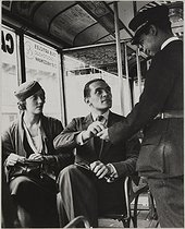 Roger-Viollet | 492270 | Ticket inspector in a bus. Paris, circa 1945. Photograph by Jean Roubier (1896-1981). Bibliothèque historique de la Ville de Paris. | © Jean Roubier / BHVP / Roger-Viollet
