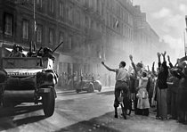 Roger-Viollet | 576828 | World War II. Liberation of Paris. The armoured cars of the division led by Leclerc arriving rue Guynemer, August 25, 1944 | © Collection Roger-Viollet / Roger-Viollet
