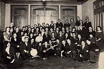 Roger-Viollet | 611129 | Group photograph with a traditional musical instrument. | © Archives Manouchian / Roger-Viollet