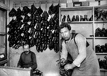 Roger-Viollet | 840404 | Former representative of the State Duma who has become a shoemaker. Paris, circa 1930. | © Albert Harlingue / Roger-Viollet