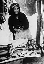 Roger-Viollet | 880905 | Bastia (Corsica). Old woman selling vegetables. | © Roger-Viollet / Roger-Viollet
