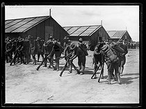 Roger-Viollet | 953730 | World War I. Arrival of the first US military contingents in France. US soldiers settling in their camp near Saint-Nazaire (France), late June 1917. Photograph published in the newspaper  Excelsior , late June 1917. | © Excelsior - L'Equipe / Roger-Viollet