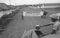 Roger-Viollet | 1031441 | Banner in a farm village, inciting workers to productivity gains. Cuba, around 1960. | © Gilberto Ante / Roger-Viollet