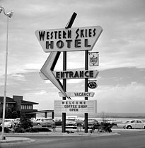 Roger-Viollet | 1053189 | Sign of the Western Skies Hotel, near Albuquerque (New-Mexico, United States), April 1964. Photograph by Hélène Roger-Viollet (1901-1985) and Jean Fischer (1904-1985). | © Hélène Roger-Viollet & Jean Fischer / Roger-Viollet