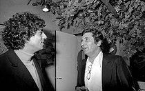 Roger-Viollet | 1058093 | Enrico Macias and Gilbert Bécaud, in Yves Montand's dressing room. Paris, Olympia, 1981. | © Bernard Lipnitzki / Roger-Viollet