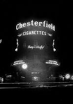 Roger-Viollet | 1066555 | Paris - Illuminated advertising for Chesterfield cigarettes | © Maurice-Louis Branger / Roger-Viollet