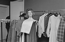 Roger-Viollet | 1216272 | Sheila (born in 1945), French singer, at her parents' fashion house, on February 9, 1964. Photograph by Michel Pansu, from the collections of the French newspaper  France-Soir . Bibliothèque historique de la Ville de Paris. | © Bernard Hermann / Fonds France-Soir / BHVP / Roger-Viollet