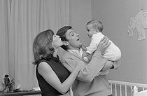 Roger-Viollet | 1283186 | Nathalie Delon (born in 1941) and Alain Delon (born in 1935) playing with their son Anthony Delon (born in 1964). France, on April 28, 1965. Photograph by Jean Laborie (1928-2014), from the collections of the newspaper  France Soir . Bibliothèque historique de la Ville de Paris. | © Jean Laborie / Fonds France-Soir / BHVP / Roger-Viollet