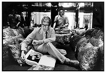 Roger-Viollet | 1376383 | Yves Saint-Laurent (1936-2008), French top designer and businessman, at his house, rue de Babylone, surrounded by his personal items. Paris (VIIth arrondissement), 1977. Photograph by André Perlstein (born in 1942). | © André Perlstein / Roger-Viollet