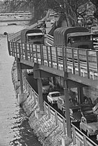 Roger-Viollet | 1379907 | Traffic on the slide and on the banks of the Seine. Paris (France), on November 30th, 1966. Photograph by claude Lechevalier (born in 1932), from the collections of the French newspaper  France-Soir.  Bibliothèque historique de la Ville de Paris. | © Lechevalier, Claude / Fonds France-Soir / BHVP / Roger-Viollet